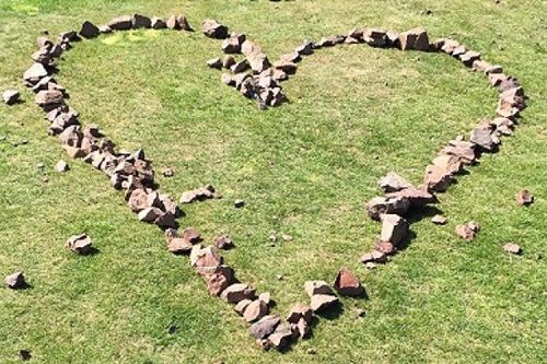 the outline of a heart with stones